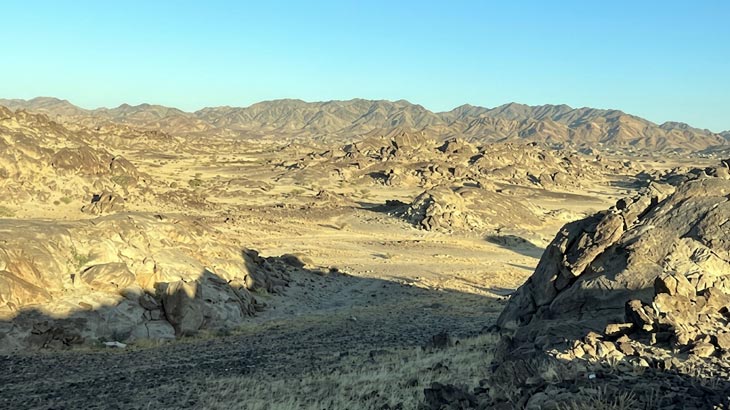 Panoramic desert mountains and valleys of New Moon Valley during a guided tour from Jeddah.