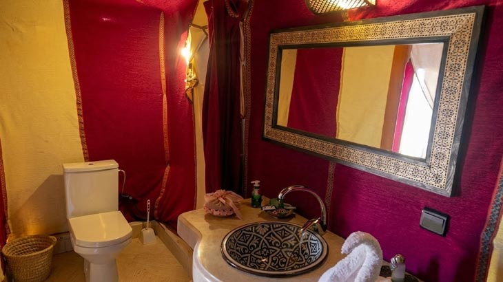 Private ensuite bathroom inside a luxury desert camp tent for rent near Jeddah.